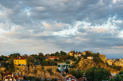 Houses in town against sky