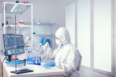 Scientist examining chemical in laboratory