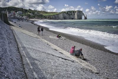 Rear view of woman walking on beach