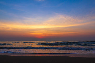 Scenic view of sea against romantic sky at sunset