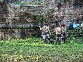 Group of people sitting on grassland