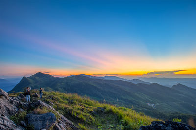 Scenic view of mountains against sky during sunset