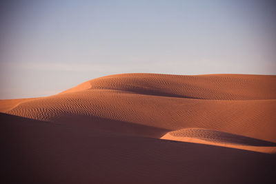 Scenic view of desert against clear sky