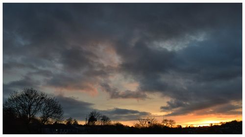 Scenic view of cloudy sky at sunset