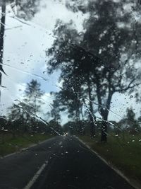 Wet road against sky