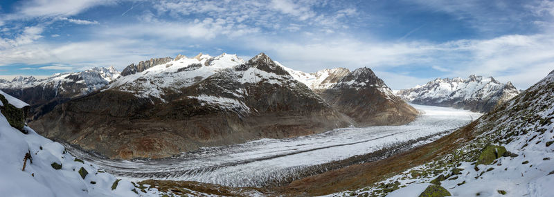 Panoramic view of freezing winter landscape. aletsch glacier stretching through valley