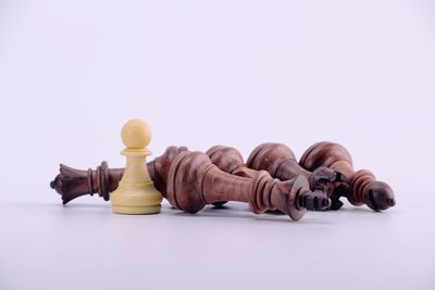 Close-up of chess pieces against white background