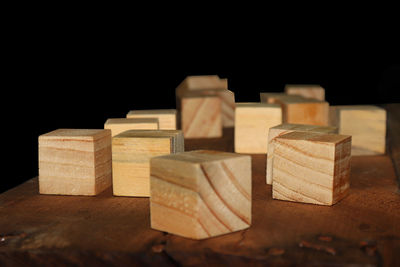 Close-up of stuffed toy on table against black background