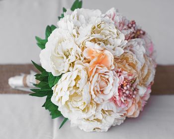 Close-up of rose bouquet on white table