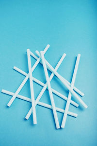 Straws on blue background