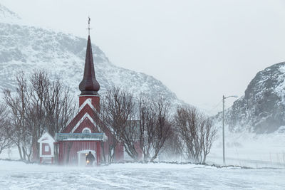 Scenic view of snow covered mountains against sky