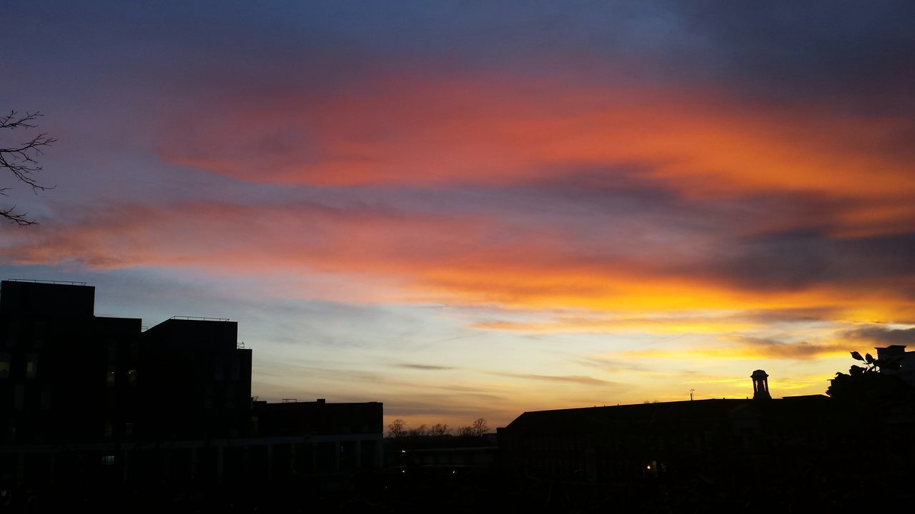 SILHOUETTE CITY AGAINST SKY DURING SUNSET