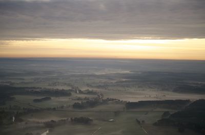 Aerial view of landscape against sky during sunset