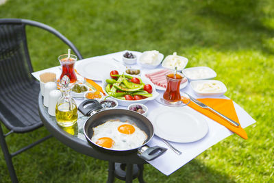 Breakfast on table in field