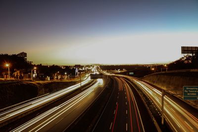 High angle view of light trails on highway at night