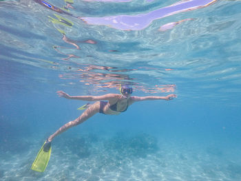 Woman swimming in sea