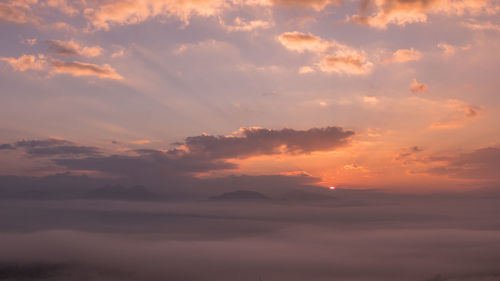 Low angle view of dramatic sky during sunset