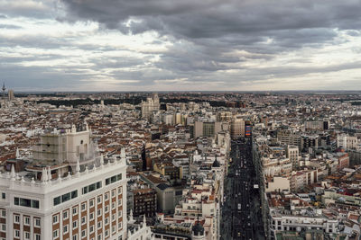 High angle view of buildings in city against sky