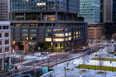 High angle view of illuminated buildings in city