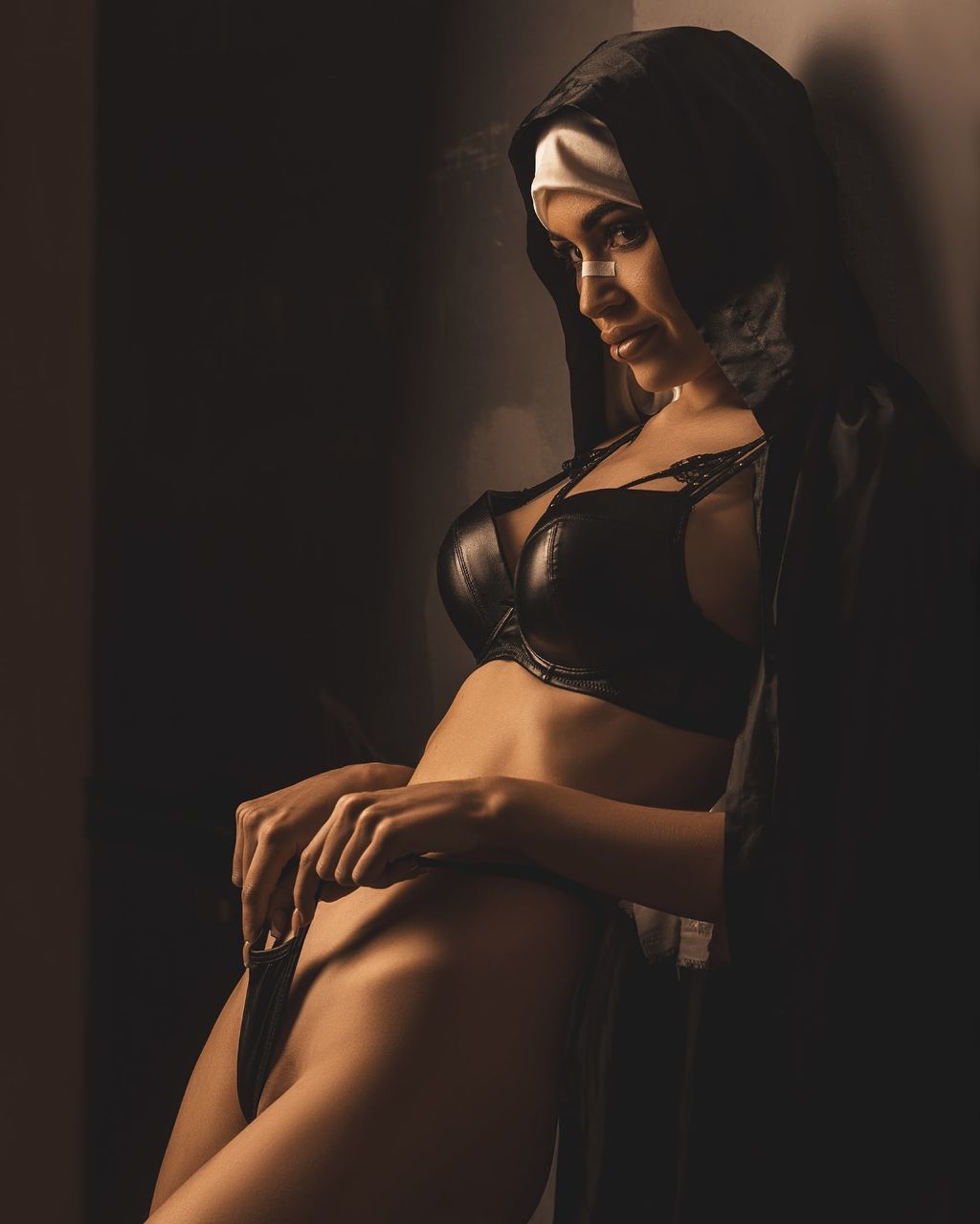 adult, women, one person, clothing, young adult, female, fashion, darkness, indoors, lifestyles, portrait, underwear, hairstyle, copy space, black, lingerie, dark, long hair, desire, photo shoot, looking, elegance, sitting, studio shot