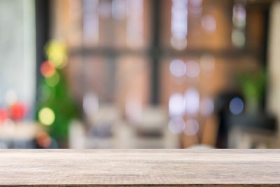 Defocused image of illuminated lights on table