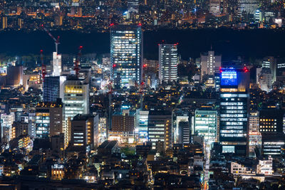 Illuminated city buildings at night