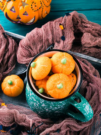 High angle view of pumpkins in bowl on table