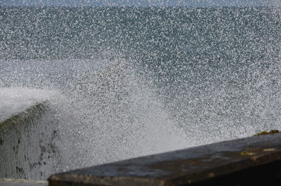 Close-up of sea waves splashing on beach