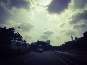 Cars on road against sky