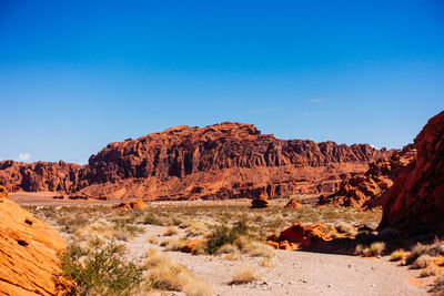 Rock formation on field against clear sky at valley of fire state park