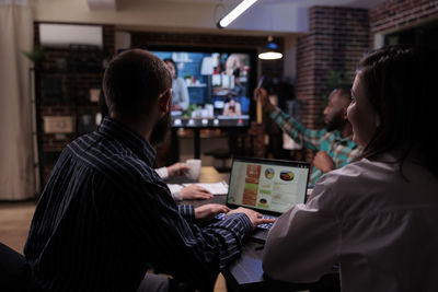 Business colleagues working in office