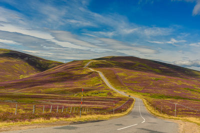 High angle view of road amidst mountains against sky