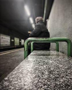 Close-up of boy sitting on floor