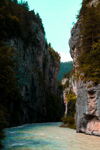 Scenic view of sea and rock formation against clear sky