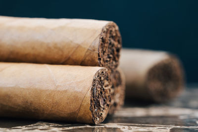 Close-up of cigars on table