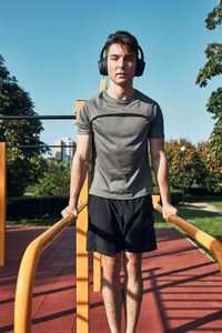 Young man exercising at park