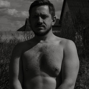 Portrait of young man standing on land