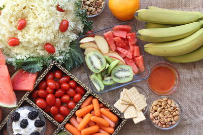 High angle view of various fruits with vegetables on table