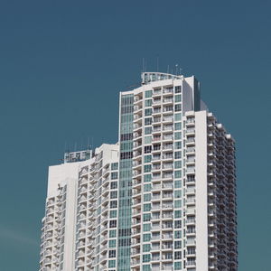 Low angle view of modern buildings against clear sky