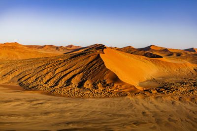 Scenic view of desert against clear sky