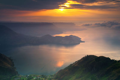 Scenic view of mountains against sky during sunset