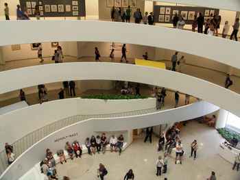 High angle view of people walking on staircase in city