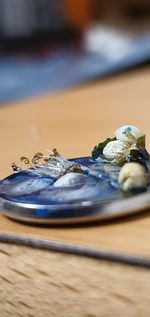 Close-up of water drop on table