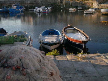 Boats moored at harbor