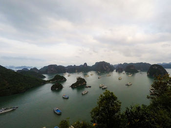 High angle view of boats in lake against sky