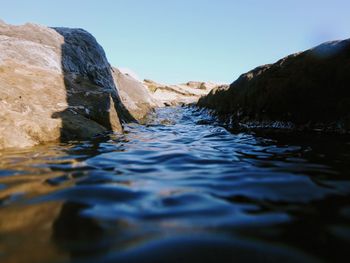 Scenic view of sea against clear blue sky
