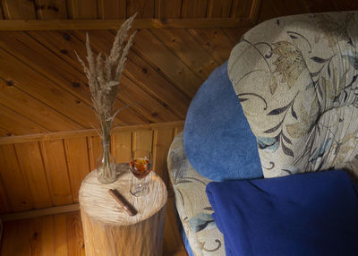 Low section of person holding wood at home