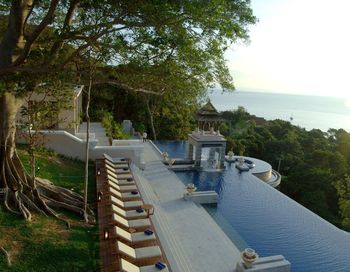 High angle view of trees by sea against sky