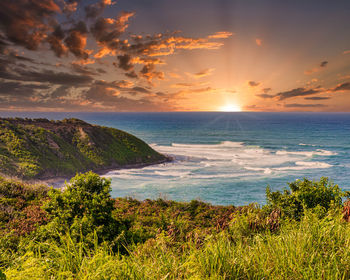 Scenic view of sea against sky during sunset