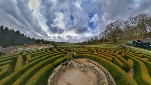 Panoramic shot of agricultural field against sky